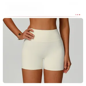 Detailed view of white high-waisted yoga shorts with wide tummy control waistband