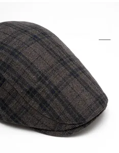 Detail of wool blend plaid beret with a bendable brim and premium texture fabric