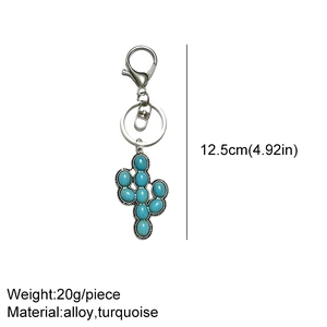Detailed view of silver cactus keychain with turquoise stone showing 12.5cm size dimension