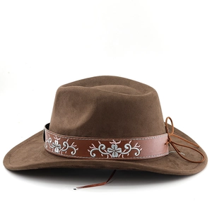 Close-up of brown suede cowboy hat with white floral embroidery and leather trim