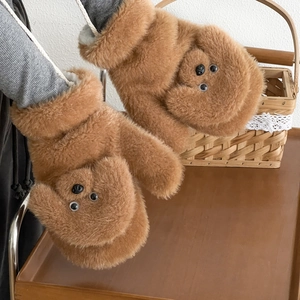 Close-up of plush brown teddy bear mittens with thick faux fur and warm lining