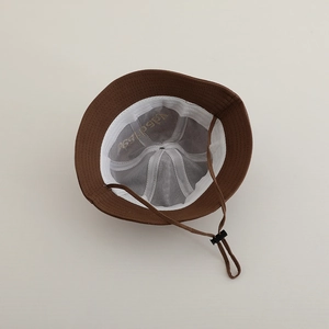 Detail of baby bear bucket hat with breathable mesh lining and adjustable chin strap