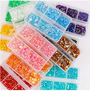 Close-up of 6-slot storage cases filled with colorful jelly flatback rhinestones for DIY