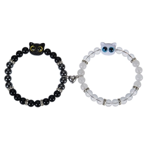 Magnetic cat couple bracelets with black and white beads and resin kitty charms