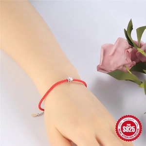 S925 sterling silver red woven bracelet with a sparkling diamond worn by a model