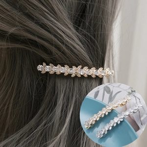 Sparkling crystal leaf hair pin in gold and silver finishes for elegant women's styling