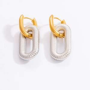 Detail view of two-tone 18k gold plated stainless steel hoop earrings with spiral silver link