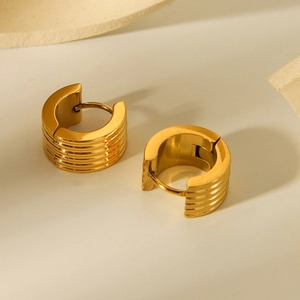 Macro shot of 18K gold plated wide ribbed hoop earrings in premium stainless steel