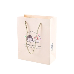 Custom pink paper gift bag for kids with cartoon illustration and golden rope handles
