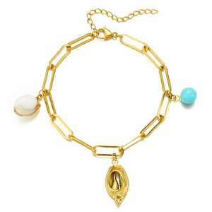 Golden stainless steel chain bracelet with white shell, gold charm, and blue stone bead