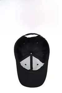 Detail of black baseball cap showing breathable mesh lining and adjustable strap buckle