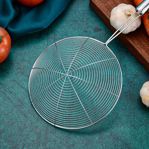Stainless steel mesh skimmer spoon with long handle shown in a professional kitchen setting