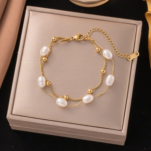 Double-layer lily of the valley bracelet with pearls and golden steel beads
