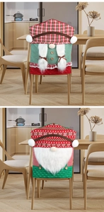 Close-up of festive gnome Christmas chair covers in red and green knit fabric