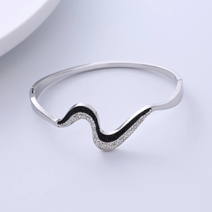 Polished wavy titanium steel bracelet with black and white crystal inlay for women