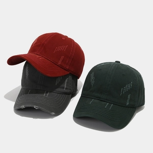 Distressed washed cotton baseball caps in burgundy, dark grey and forest green colors
