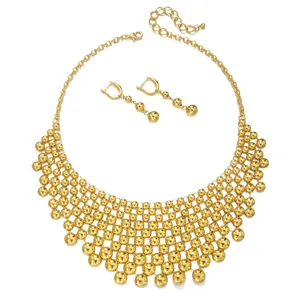 Exaggerated gold beaded necklace and earring set with polished multi-layer metallic finish