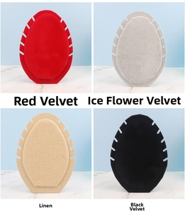 Detail of necklace display boards in red velvet, grey ice velvet, beige linen and black velvet