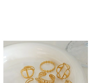 Detail view of gold hollow U-shape earring set with vintage geometric texture design