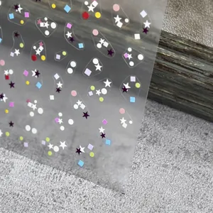 Colorful thin nail art stickers with star and circle patterns on sheet to 495
