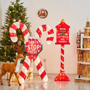 LED lighted Santa Stop Here candy cane sign and red Christmas mailbox garden decor