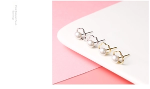 Macro detail of S925 silver cloud earrings with natural freshwater pink pearls