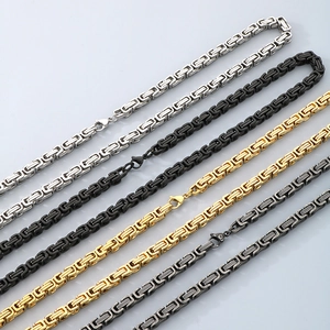 Detail of Byzantine link chains in silver, gold, and black finish with lobster clasps