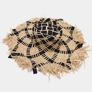 Two-tone raffia sun hat with black woven checkered pattern and frayed fringe brim