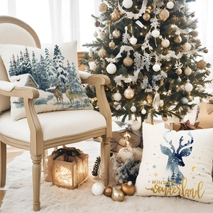Winter Wonderland Christmas pillow covers with fox and deer patterns on linen fabric