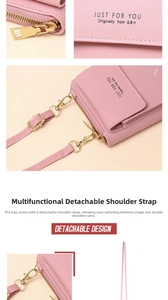 Detailed view of pink vertical crossbody phone bag with detachable gold-tone hardware strap.