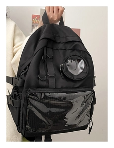 Detail of black Japanese style backpack featuring transparent heart window for accessories