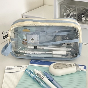 Detail of multi-layer mesh pencil case showing large capacity storage and clear window