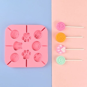 Pink 8-slot silicone lollipop mold featuring bear and cat paw patterns with sticks