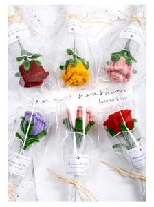 Detail of handcrafted chenille stem rose bouquets in multiple colors with gift wrapping