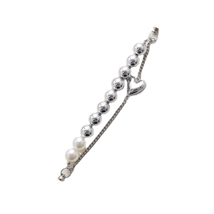 Silver bead bracelet with heart charm and pearls on a white background for versatile styling