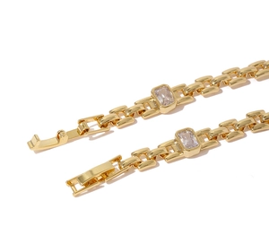 Detailed macro shot of 18K gold plated brass watchband link bracelet with zircon inlay