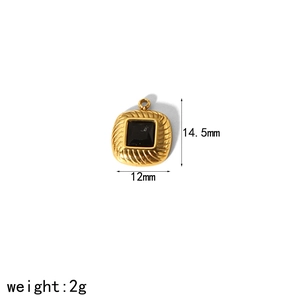 Macro detail of 14.5x12mm gold square pendant with central black gemstone inlay