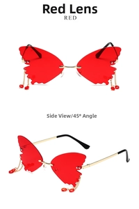 Detail view of red butterfly rimless sunglasses with gold chains and bead tassels