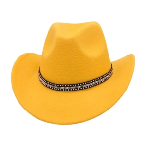 Detail view of yellow wool cowboy hat with sparkling rhinestone band on white background