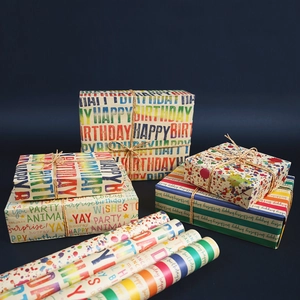 Colorful Kraft birthday wrapping paper rolls with vibrant graffiti and party animal prints