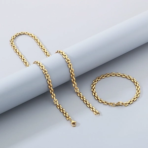 Detailed close-up of 18k gold plated hollow square link necklace and bracelet set