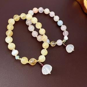 Lustrous freshwater pearl and natural stone stretch bracelet with delicate petal pendant