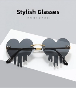 Detail of heart-shaped rimless sunglasses with unique fluid drip design and gold frames