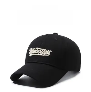 Close-up of 3D embroidered MirrorTiger letters on a black twill cotton baseball cap