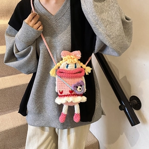 Handmade crochet girl doll crossbody bag with pink sausage lips and plush bear charm