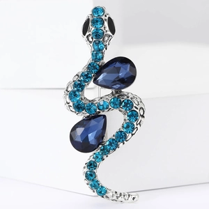 Vintage silver snake brooch with blue rhinestones and pear-cut blue gemstones