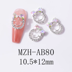 Detail view of smiley face nail art charm with aurora bowknot, size 10.5x12mm on nails