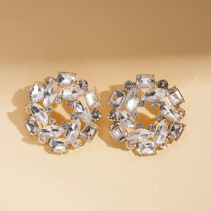 Close-up of elegant crystal cluster stud earrings with gold metal base and various cuts