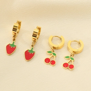 Detail of 18K gold stainless steel hoop earrings with red strawberry and cherry charms