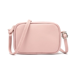 Minimalist light pink crossbody square bag with adjustable strap in fine faux leather